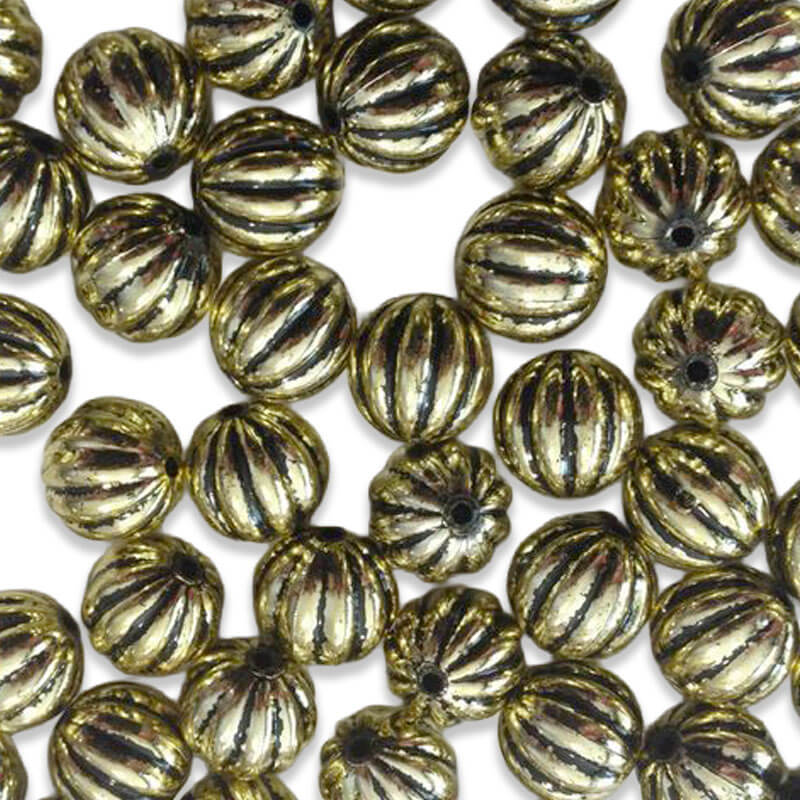 Bolas metálicas doradas con relieve estriado
