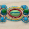 Aplique decorativo con piedras de colores para confección